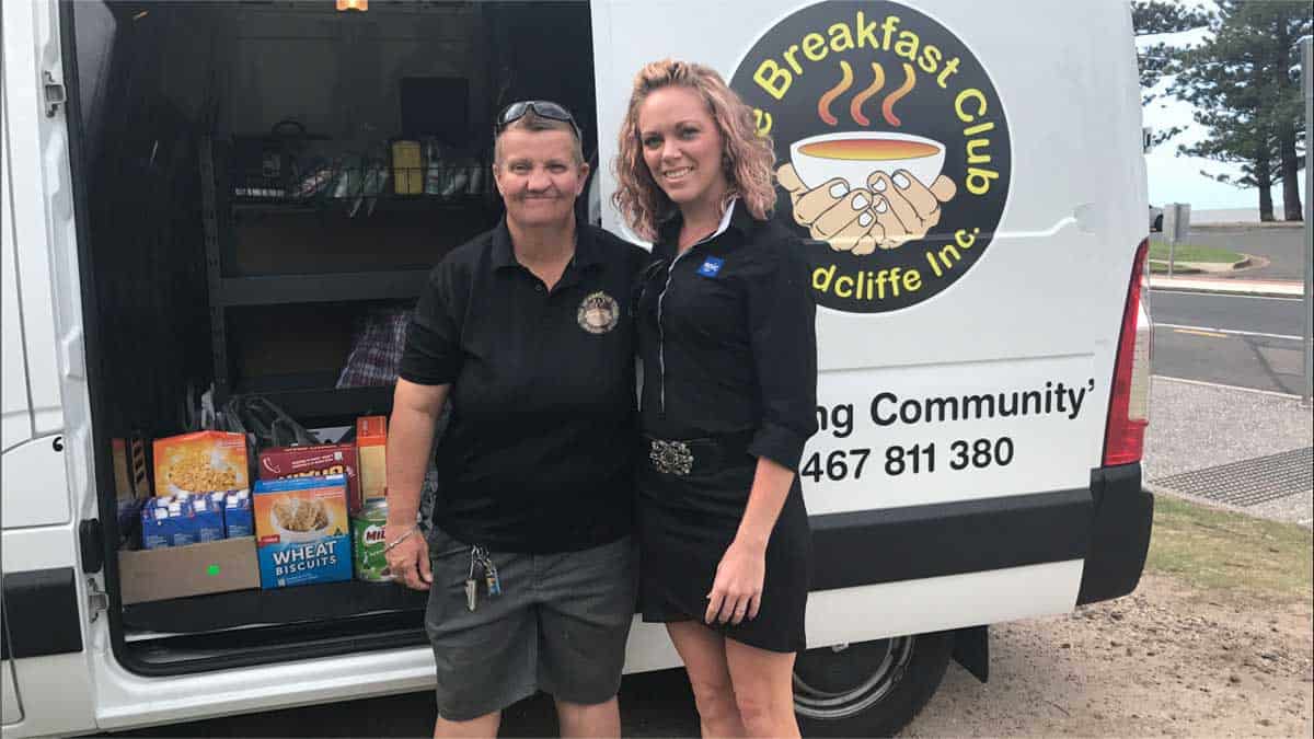 EPIC Assist's Tammy Lee with The Breakfast Clubs founder, standing in front of The Breakfast Club van