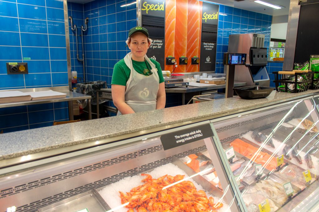 Tiff behind the deli with a grin at Woolworths Bundaberg