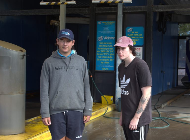 Kyah and Riley standing outside Hervey Bay Boat & Car Wash