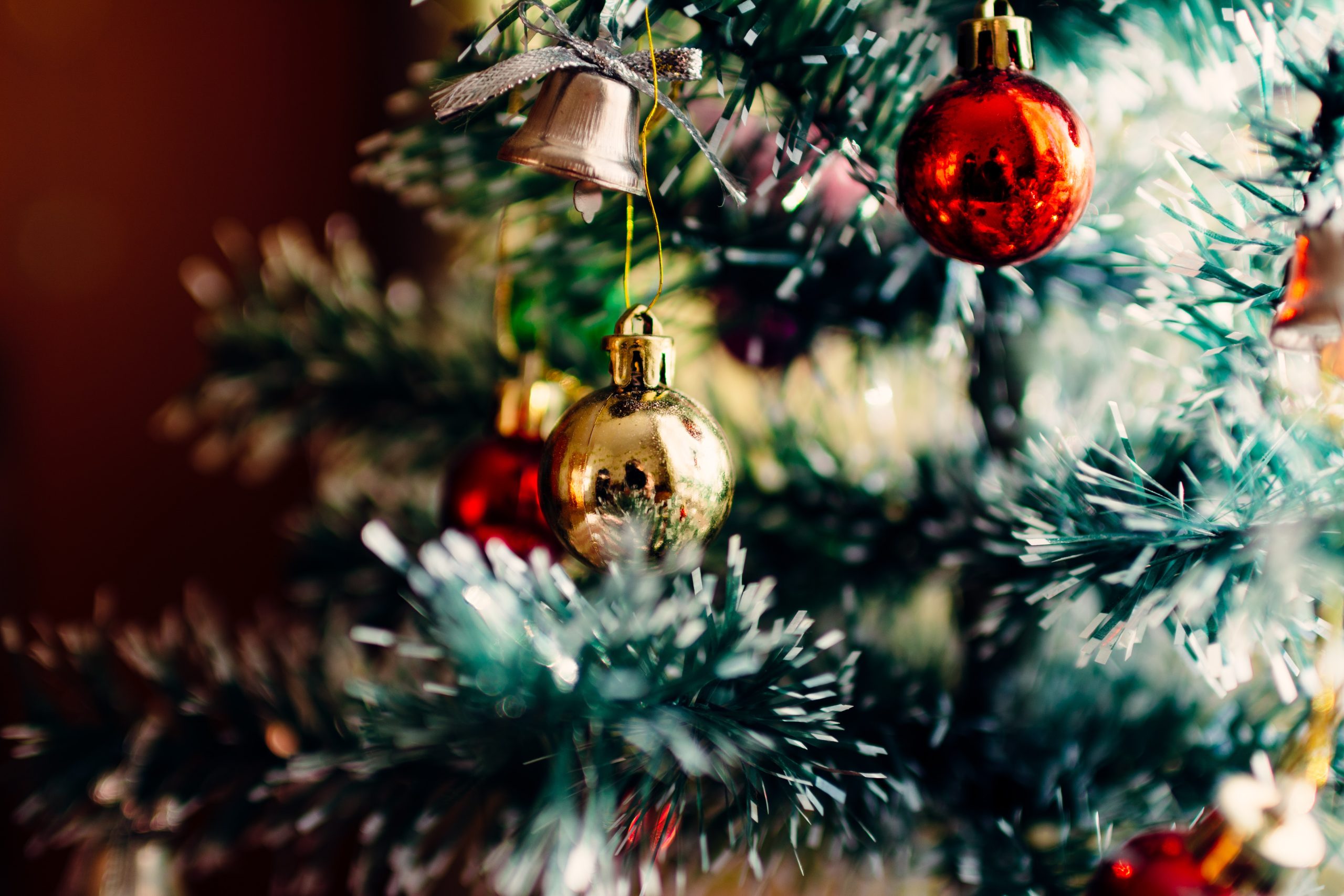Baubles hanging on a Christmas tree.