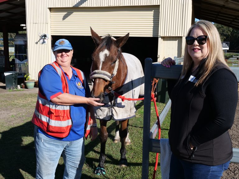 Megan and the stable master at Bribie Island Saddle Club