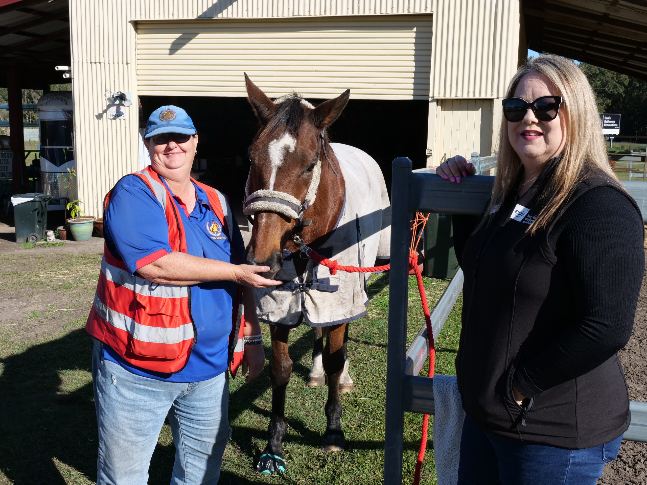 Megan and the stable master at Bribie Island Saddle Club